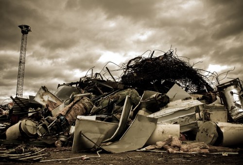 Experts sorting and recycling items during home clearance